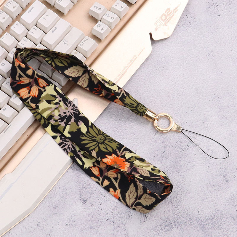 Cordón de tela para celular o multiusos crisantemo negro